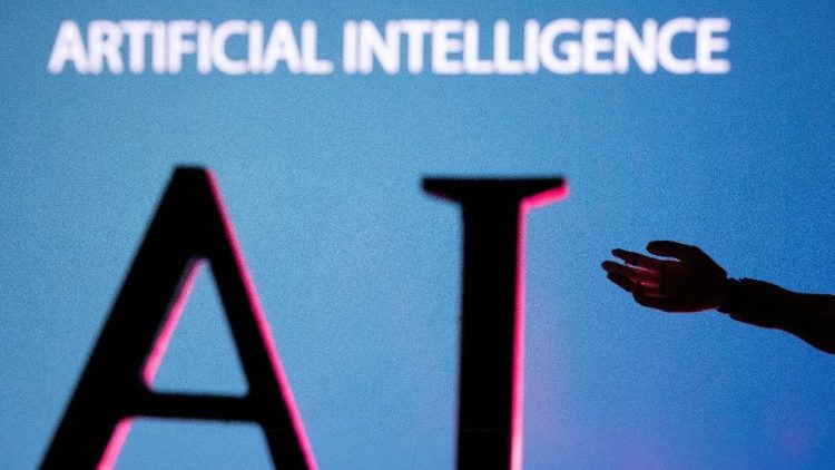 FILE PHOTO: Illustration shows AI (Artificial Intelligence) letters and robot hand miniature