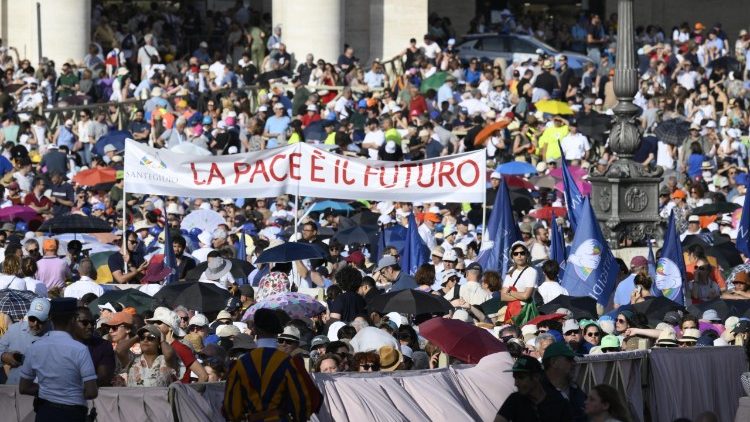 Pilgrims gather in Saint Peter's Square ahead of the prayer service for the Vigil of Pentecost